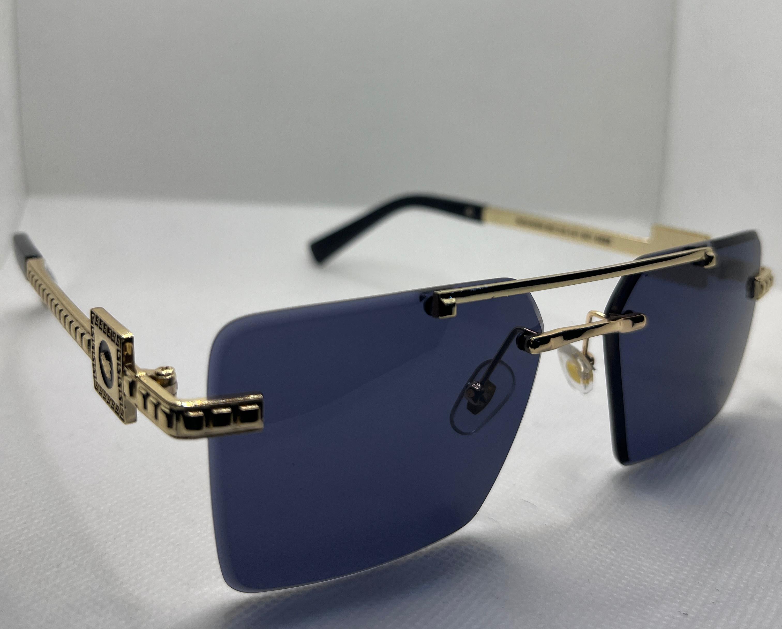  Meeran Royal sunglasses with blue gradient lenses and a Brown/gold frame, featuring UV protection